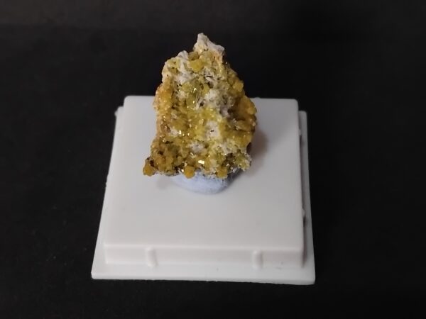 Pyromorphite accompanied by small white tabular cerussite crystals.